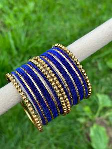 Blue velvet bangles set with golden beaded kangan’s