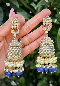 Blue pearl loaded long Jhumka earrings in Kundan