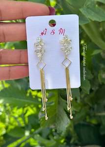 Golden hanging earrings in western style