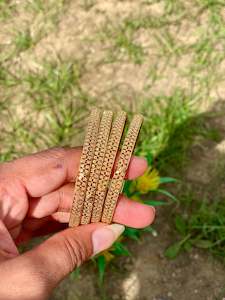Golden bangles (set of 4) B1