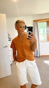 20 Tops: Tan twist hem top