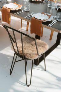 Products: Sheepskin Chair Cover - Event Hire - Twelve Tables