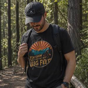 Cryptid Urban Legend T Shirts: Bigfoot Hiking Tee - Funny Outdoor Graphic T Shirt in Organic Cotton